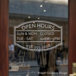Custom open hours decal applied on wooden glass door, business storefront vinyl lettering, personalized store hours sticker by TheRetractableBanner.Shop