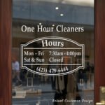 Custom open hours decal applied on wooden glass door, business storefront vinyl lettering, personalized store hours sticker by TheRetractableBanner.Shop