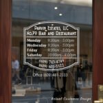 Custom open hours decal applied on wooden glass door, business storefront vinyl lettering, personalized store hours sticker by TheRetractableBanner.Shop
