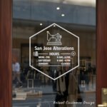 Custom open hours decal applied on wooden glass door, business storefront vinyl lettering, personalized store hours sticker by TheRetractableBanner.Shop
