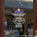 Custom open hours decal applied on wooden glass door, business storefront vinyl lettering, personalized store hours sticker by TheRetractableBanner.Shop