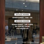 Custom open hours decal applied on wooden glass door, business storefront vinyl lettering, personalized store hours sticker by TheRetractableBanner.Shop