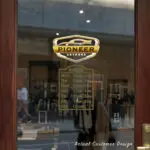 Custom open hours decal applied on wooden glass door, business storefront vinyl lettering, personalized store hours sticker by TheRetractableBanner.Shop