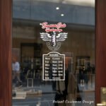 Custom open hours decal applied on wooden glass door, business storefront vinyl lettering, personalized store hours sticker by TheRetractableBanner.Shop