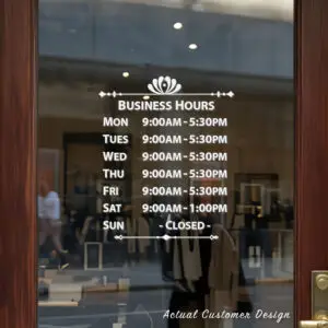 Custom open hours decal applied on wooden glass door, business storefront vinyl lettering, personalized store hours sticker by TheRetractableBanner.Shop