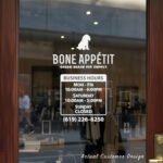 Custom open hours decal applied on wooden glass door, business storefront vinyl lettering, personalized store hours sticker by TheRetractableBanner.Shop