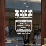 Custom open hours decal applied on wooden glass door, business storefront vinyl lettering, personalized store hours sticker by TheRetractableBanner.Shop