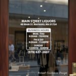 Custom open hours decal applied on wooden glass door, business storefront vinyl lettering, personalized store hours sticker by TheRetractableBanner.Shop